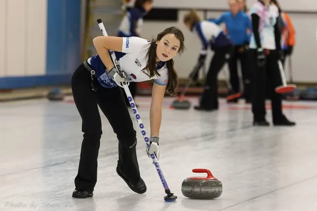 A curler delivering a stone at the 2015 Canada Winter Games in Prince George