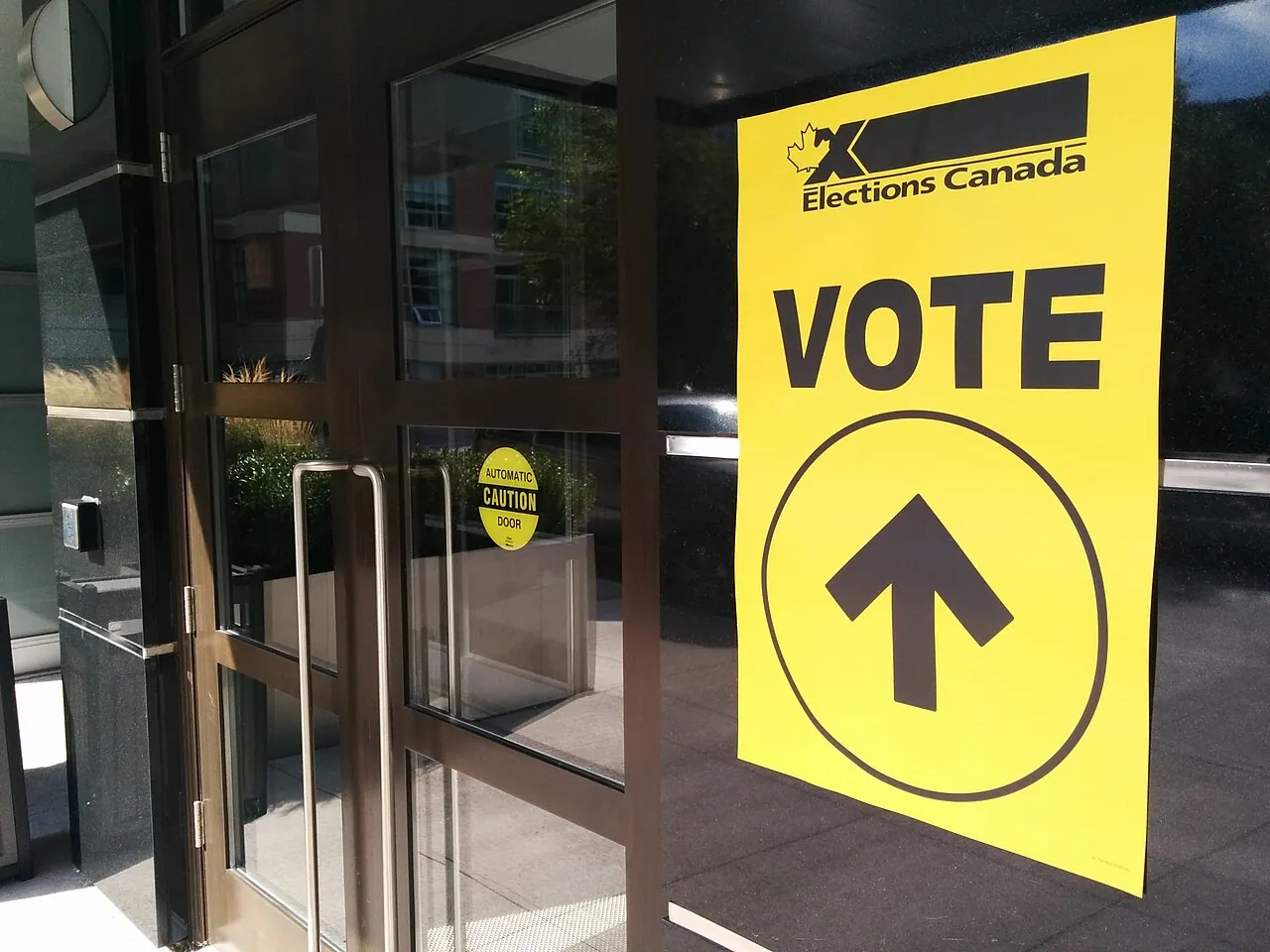 Elections Canada vote sign on the doors of a polling station