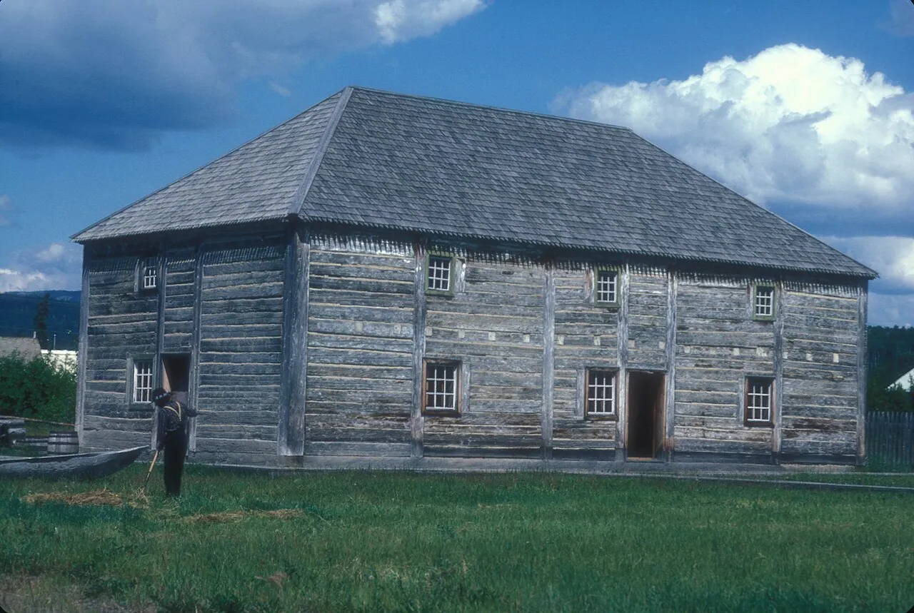 A large weathered log warehouse at Fort St. James National Historic Site