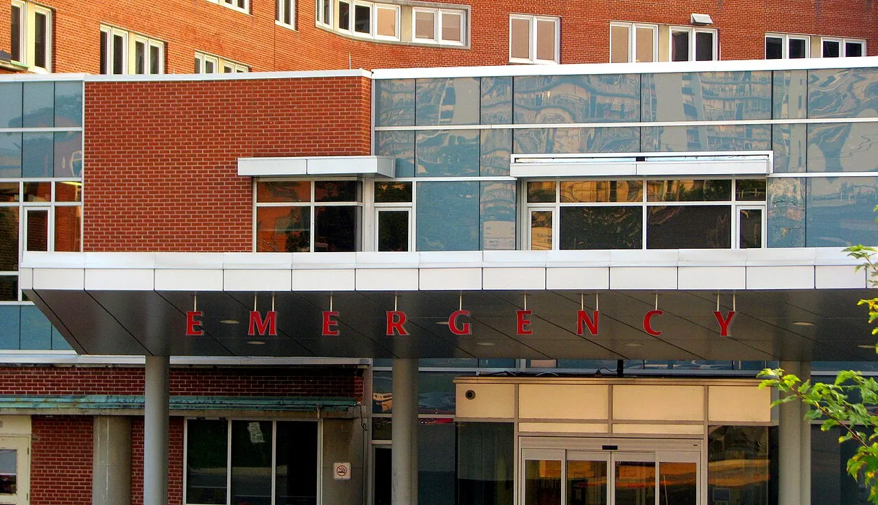 The red-lettered emergency department entrance of a Canadian hospital (Grand River Hospital in Kitchener, Ontario, shown as a generic example)