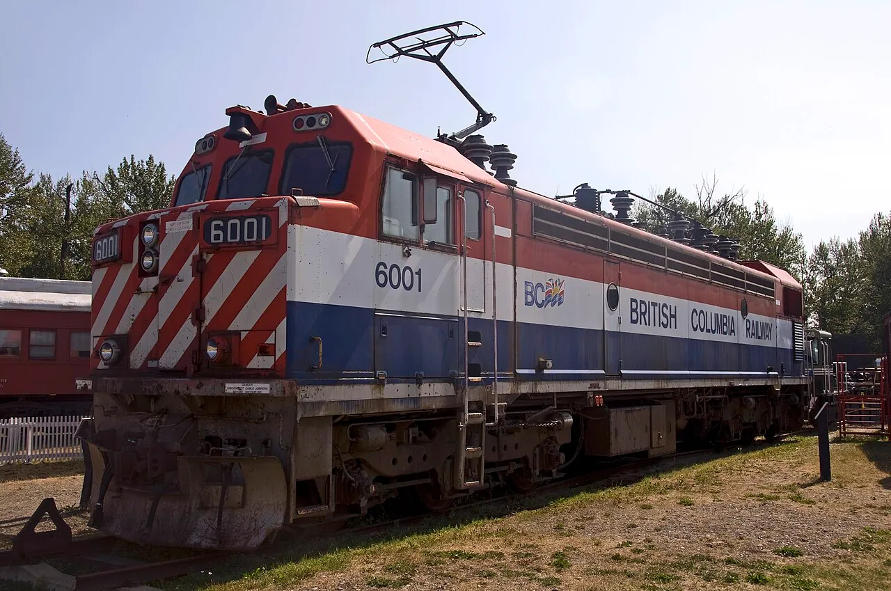 A red, white and blue BC Rail electric locomotive on display