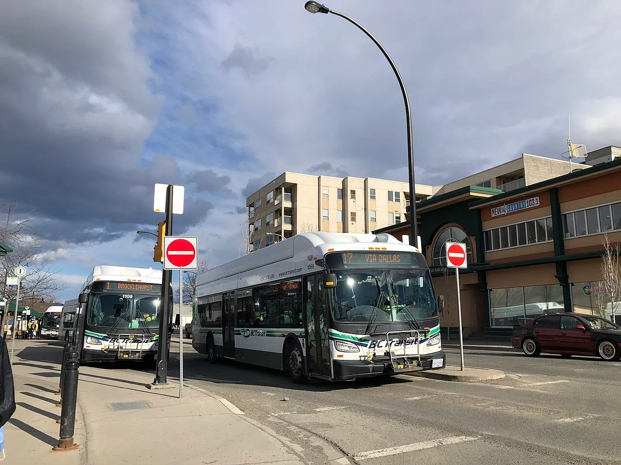 Two BC Transit buses at a downtown stop (Kamloops, shown as an example of the same BC Transit fleet that serves Prince George)