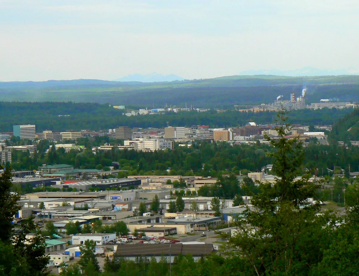View east over Prince George from University Hill, with the city in the valley and forested plateau beyond