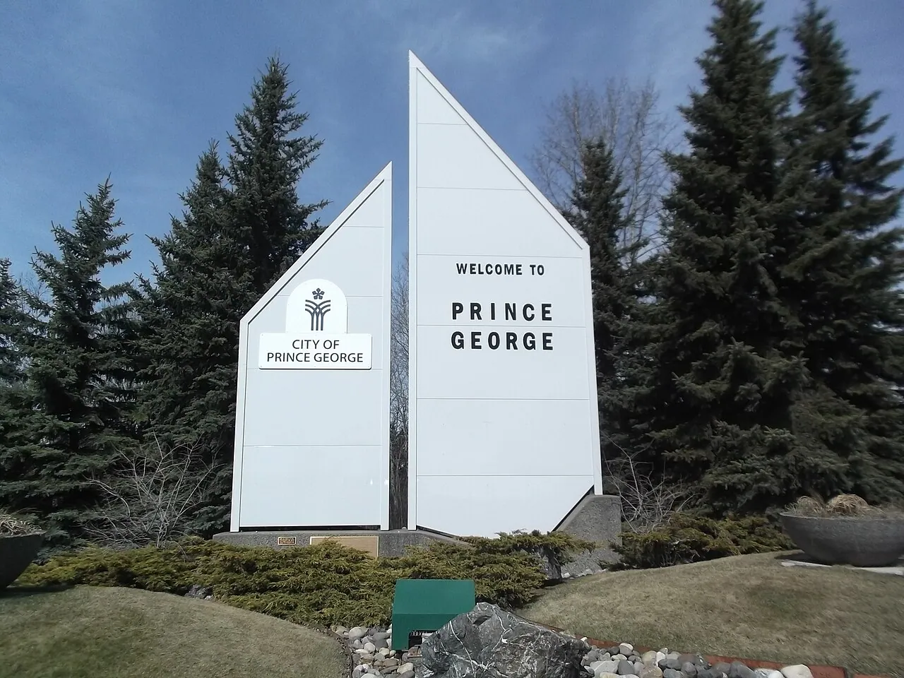 The white ‘Welcome to Prince George’ sign surrounded by spruce trees