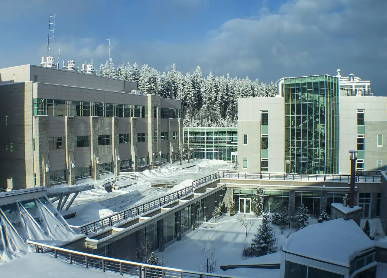 UNBC campus buildings in winter with snow on the ground